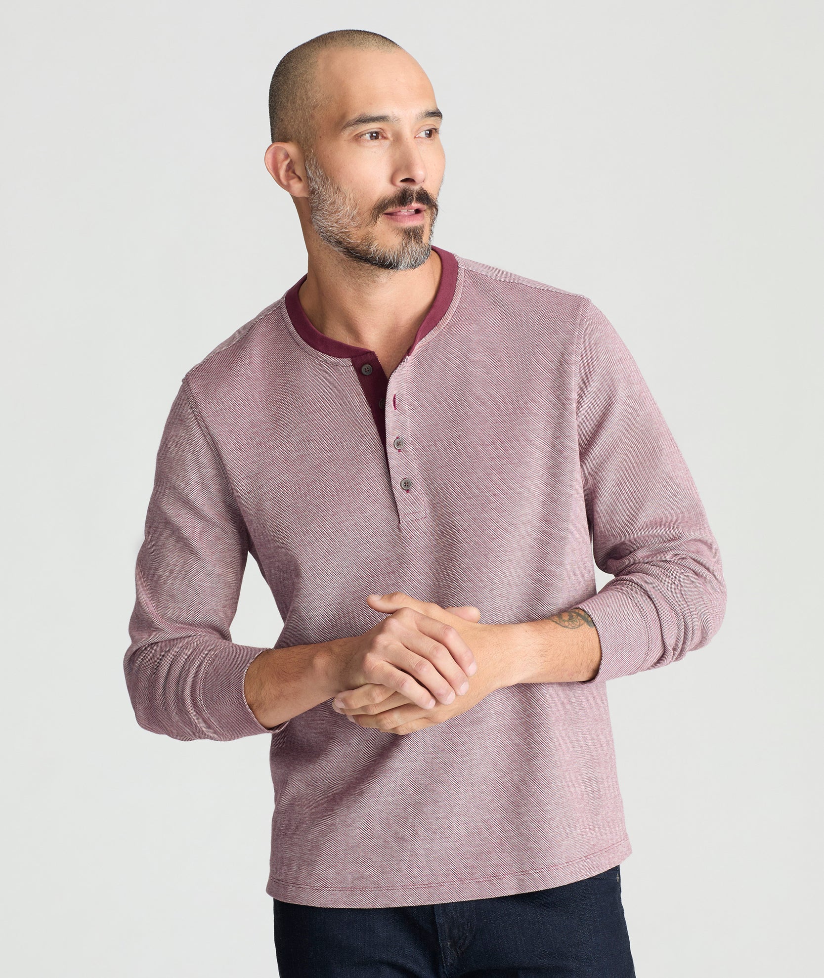 Model is wearing UNTUCKit Cascudo LS Pique Henley in Port Royal.