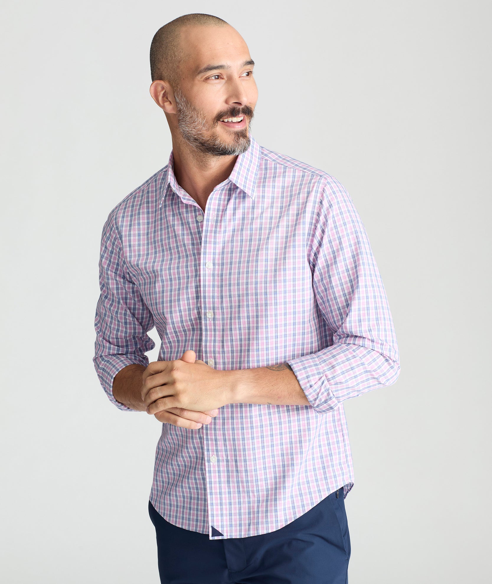 Model is wearing UNTUCKit dolcetto wrinkle free button down.