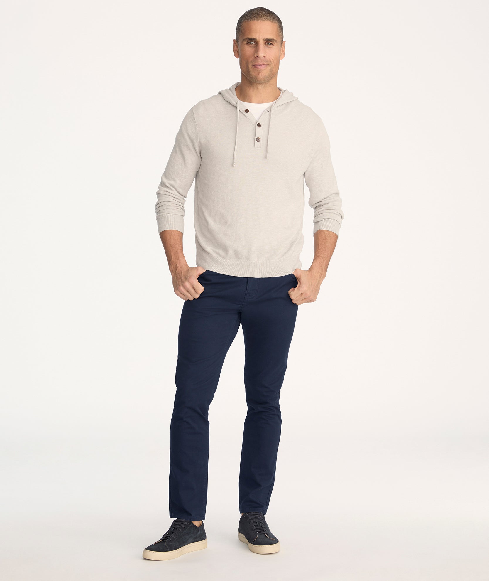 Model is wearing UNTUCKit 5-Pocket Chino Pants in navy - full body