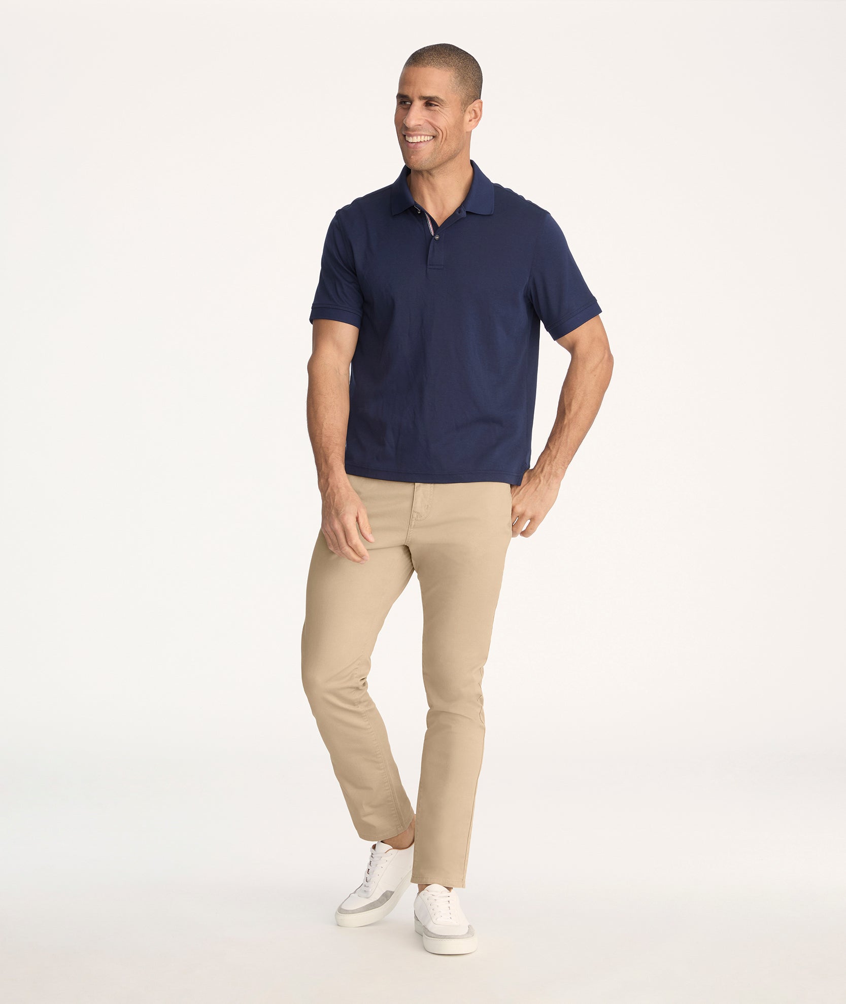 Model is wearing UNTUCKit 5-Pocket Chino Pants in Khaki - full body