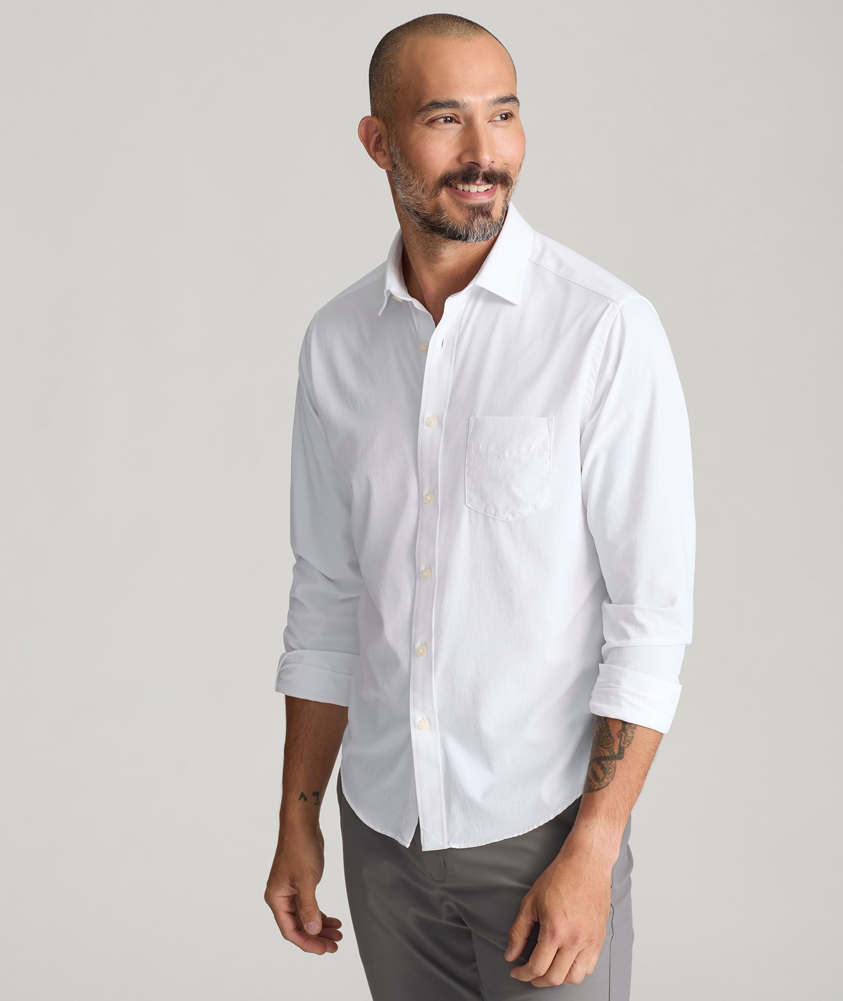 Model is wearing UNTUCKit Gironde shirt in white.