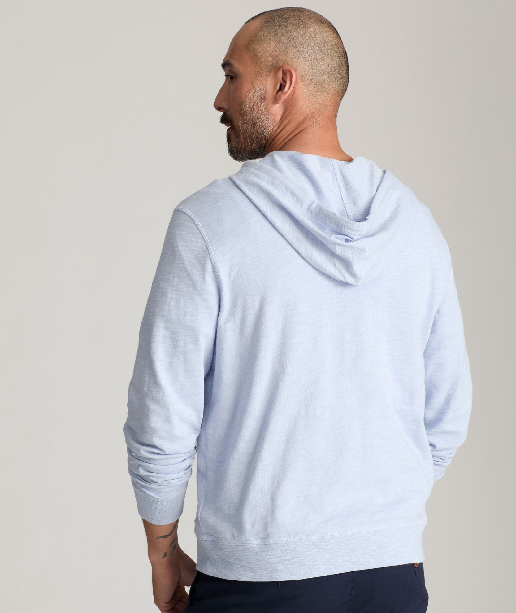 Model is  wearing UNTUCKit Griffey Slub Hoodie in Zen Blue.