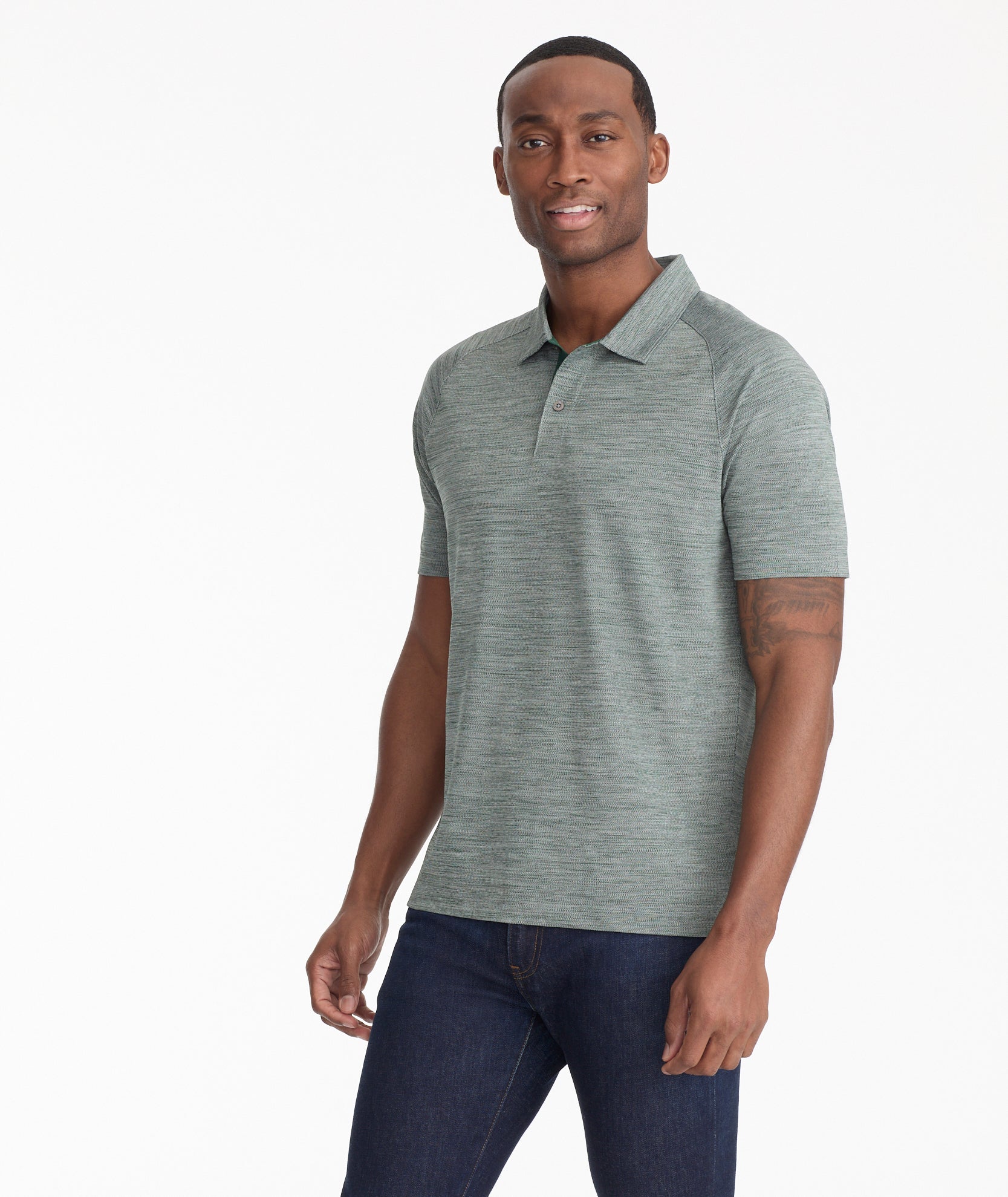 Model wearing an UNTUCKit Dark Green No Sweat Heathered Polo