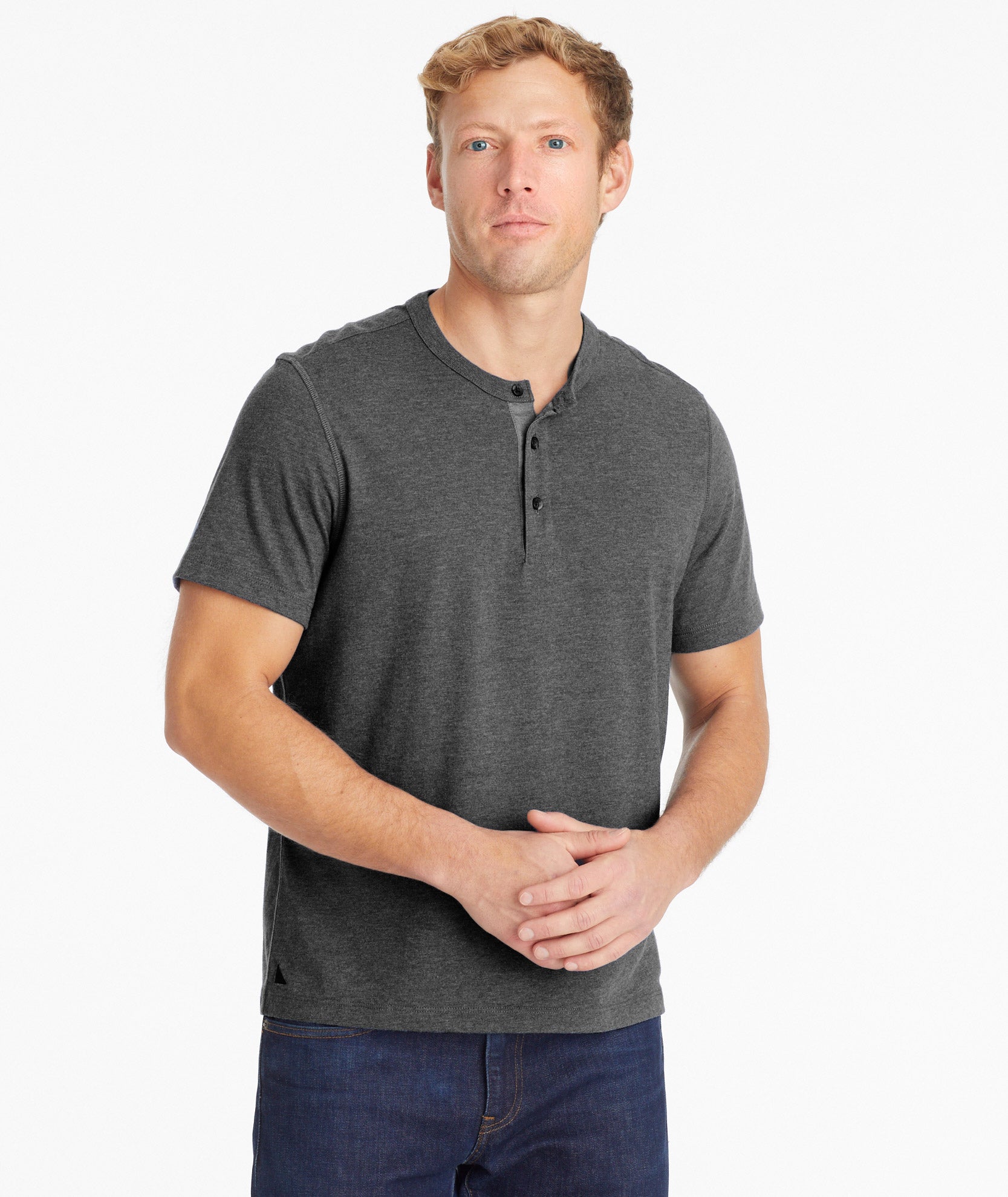 Model is wearing UNTUCKit Jericho henley in gray.