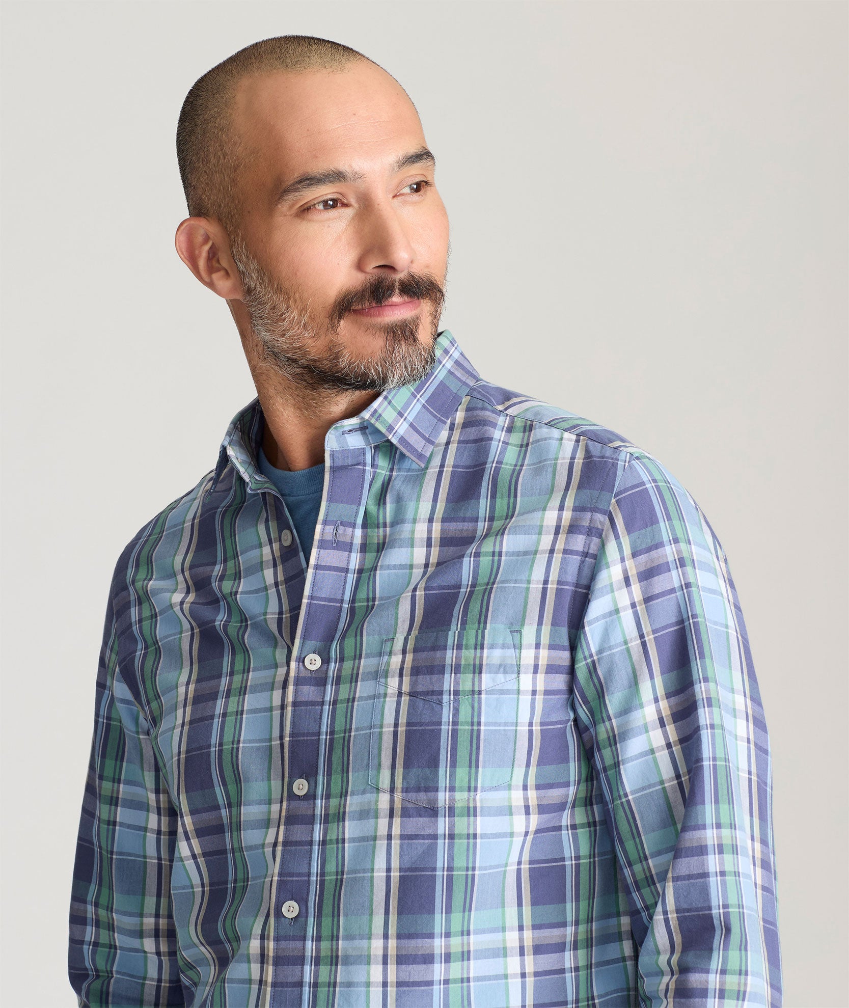 Model is wearing UNTUCKit Rombauer shirt in summer plaid. 