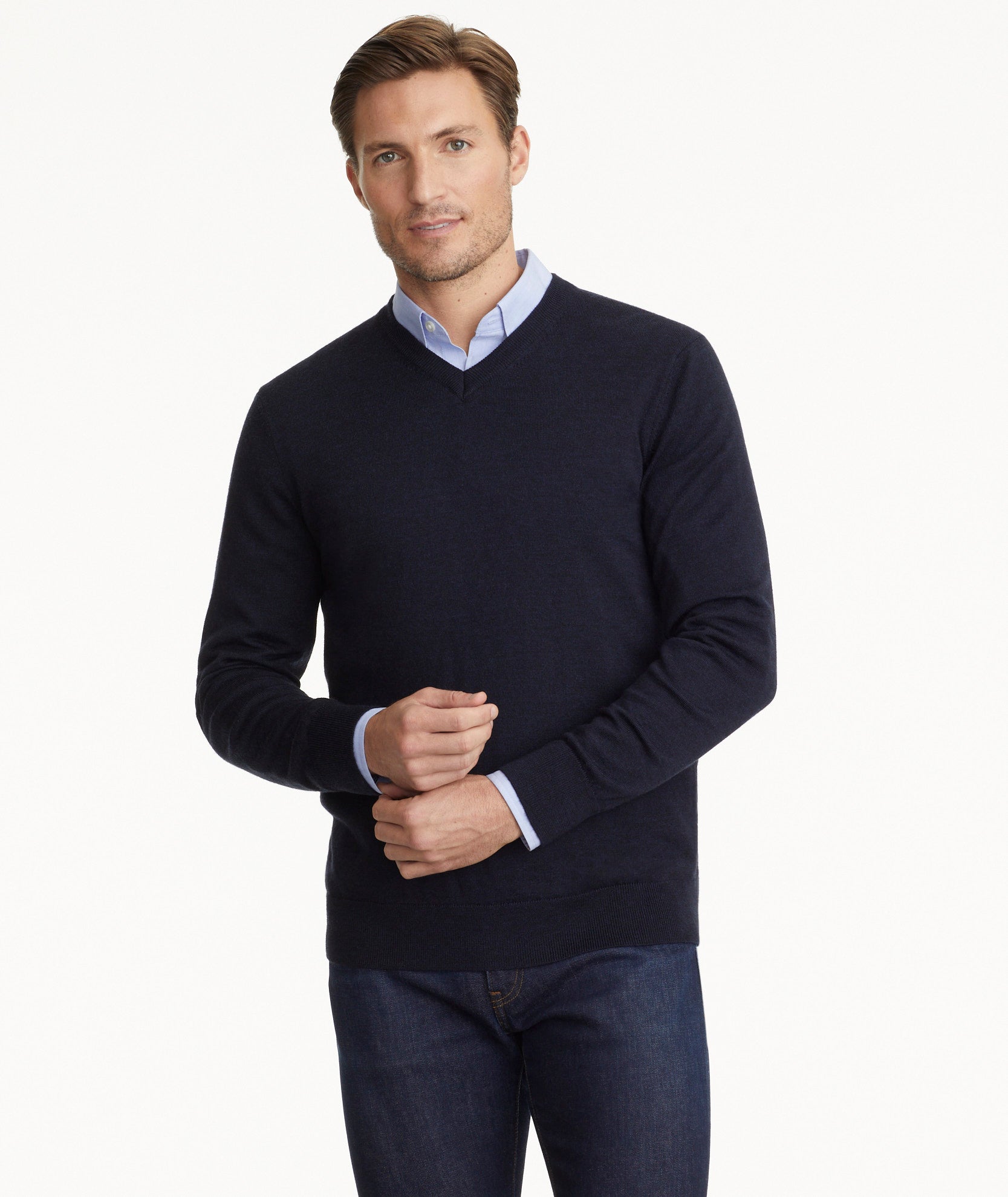 Model is wearing UNTUCKit sweater in navy.