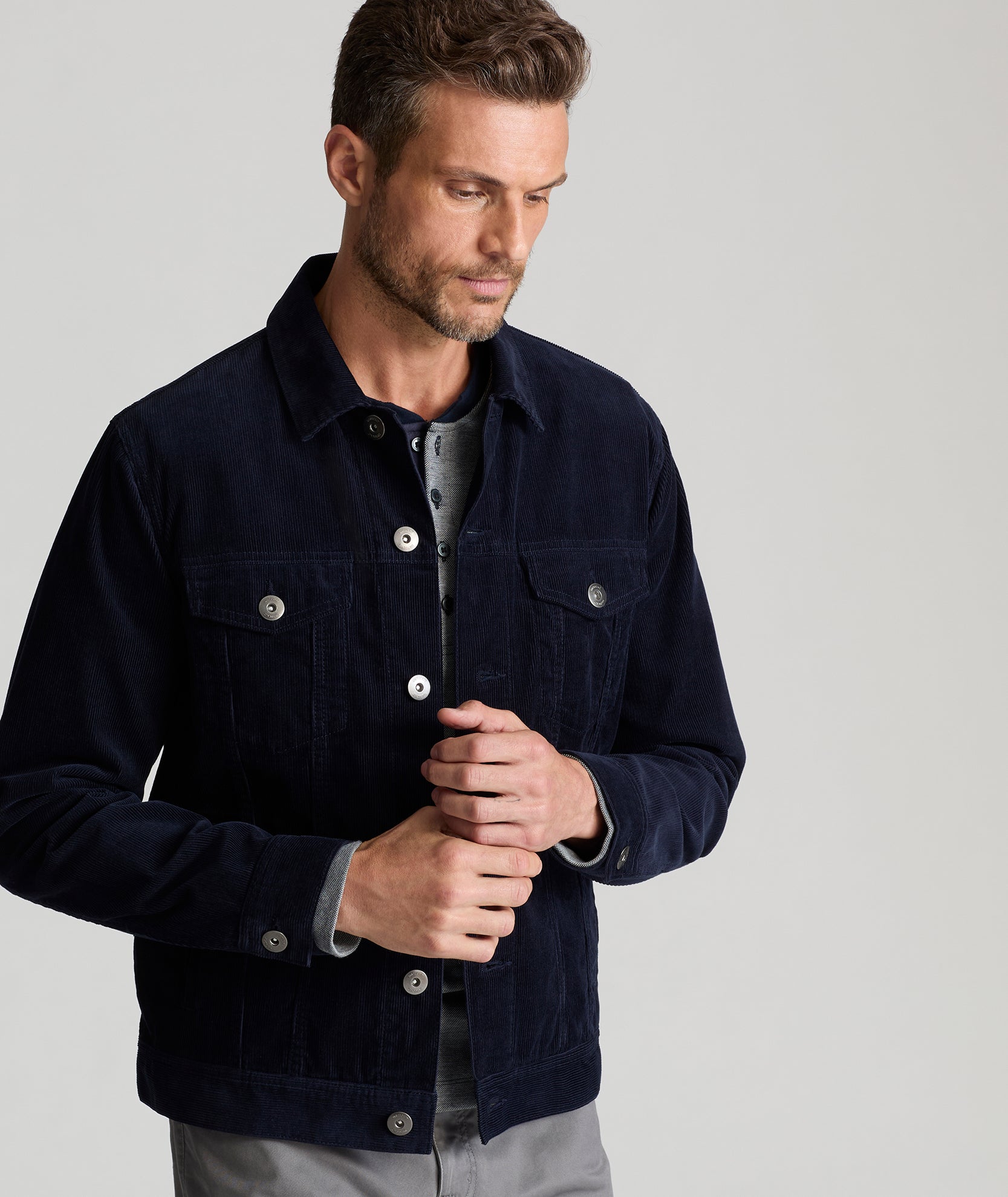 Model is wearing UNTUCKit Tibouren cord jacket in Navy.