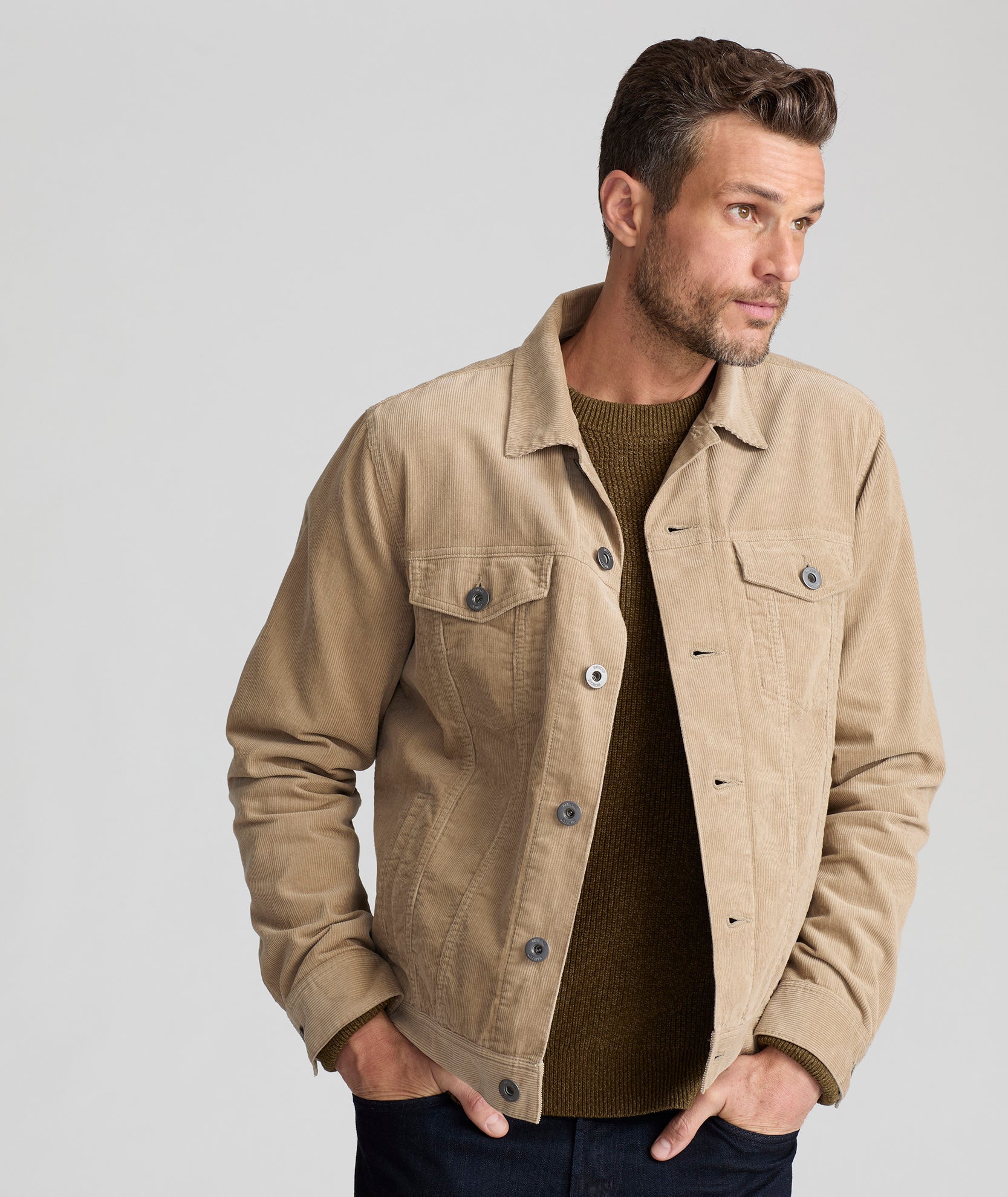 Model is wearing UNTUCKit Tibouren cord trucker jacket in khaki.