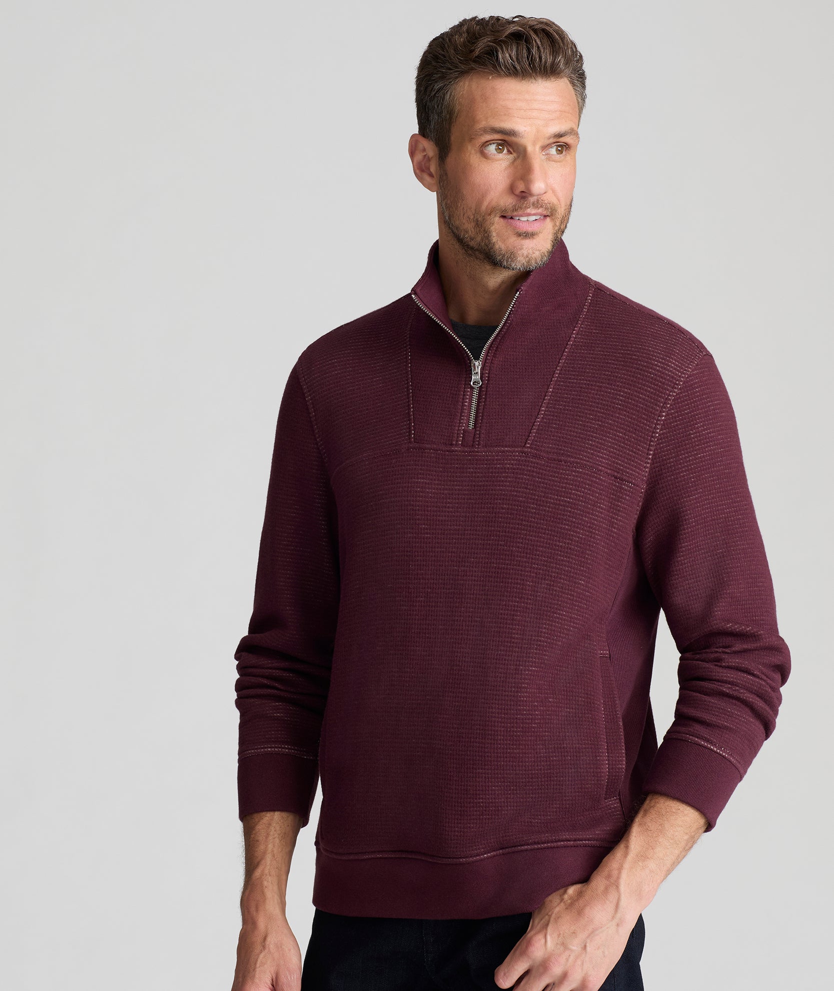 Model is wearing UNTUCKit Verzaro Textured Quarter-Zip in Winetasting.