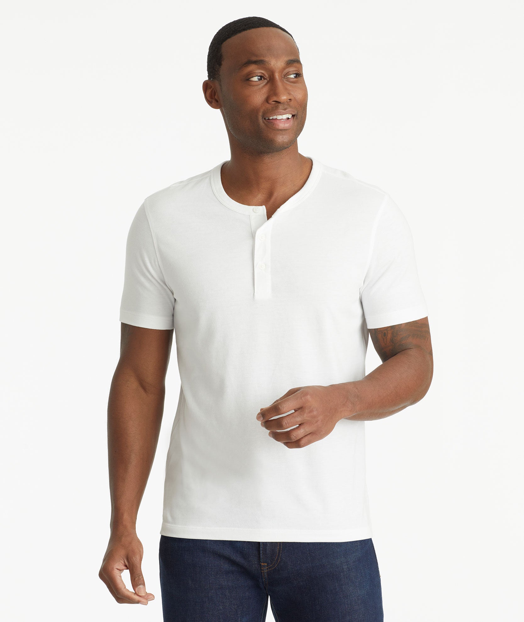 Model wearing an UNTUCKit White Ultrasoft Short-Sleeve Henley