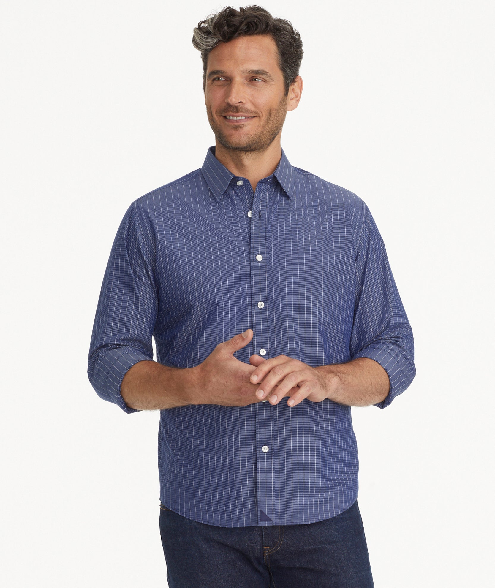 Model is wearing UNTUCKit Wrinkle-Free Gifford Shirt in Blue & White Stripe.